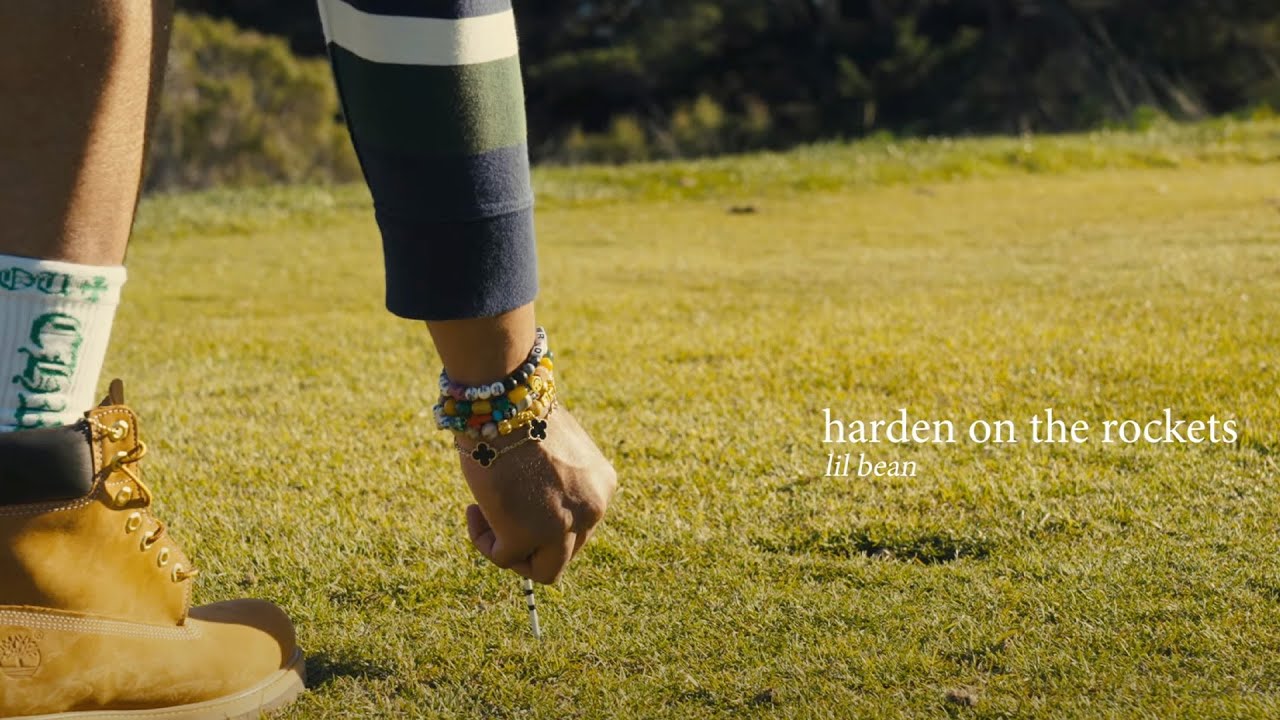 Freshly out the gate, “Harden On The Rockets” by Lil Bean is here! Dropped today, this trap banger delivers an aggressive but chill beat that strikes the perfect balance. The music video takes it up a notch, filmed on a sprawling golf course—unexpected and dope.